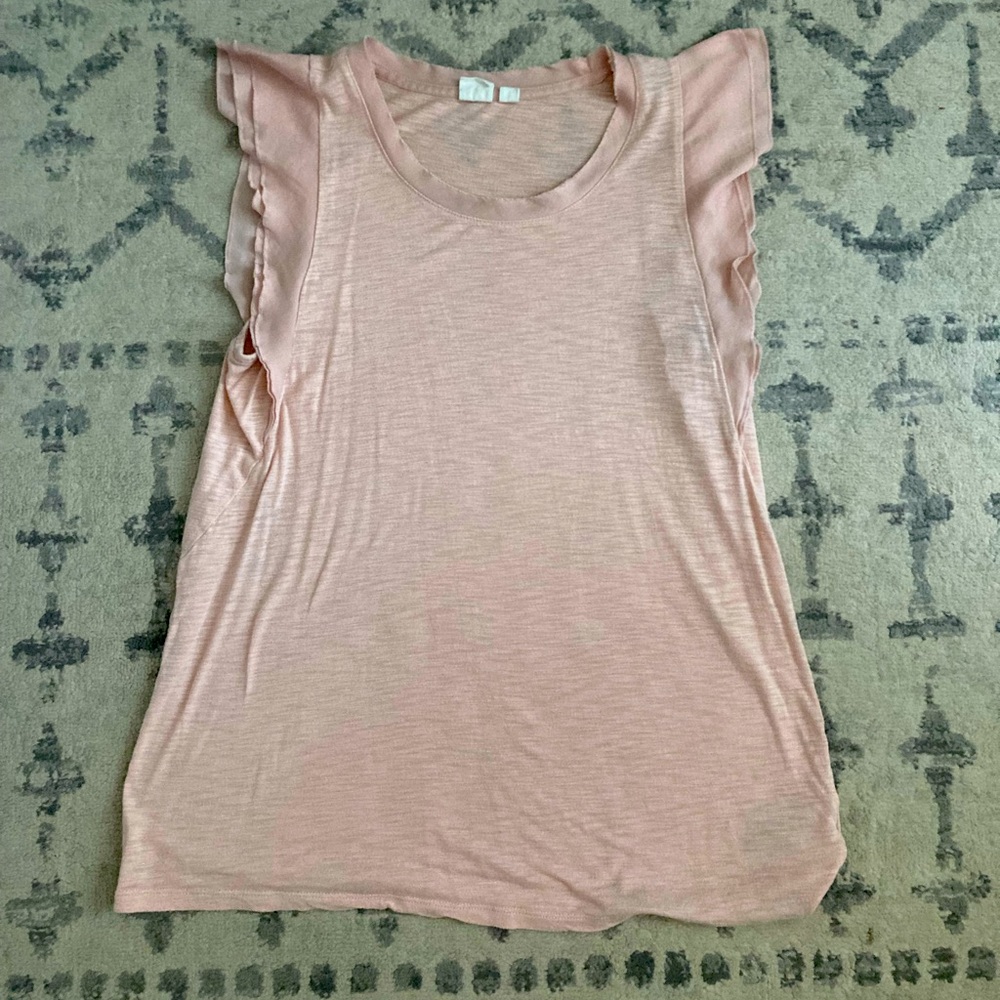 Pink blouse perfect for warm weather and layering with flutter sleeves.